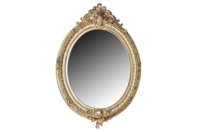 Lot 353 - AN 19TH CENTURY STYLE OVAL GILT FRAMED MIRROR