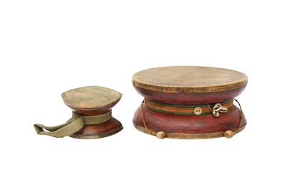 Lot 190 - A LARGE TIBETAN RITUAL DRUM, DAMARU TOGETHER WITH A CARVED WOOD RITURAl DRUM, DAMARU