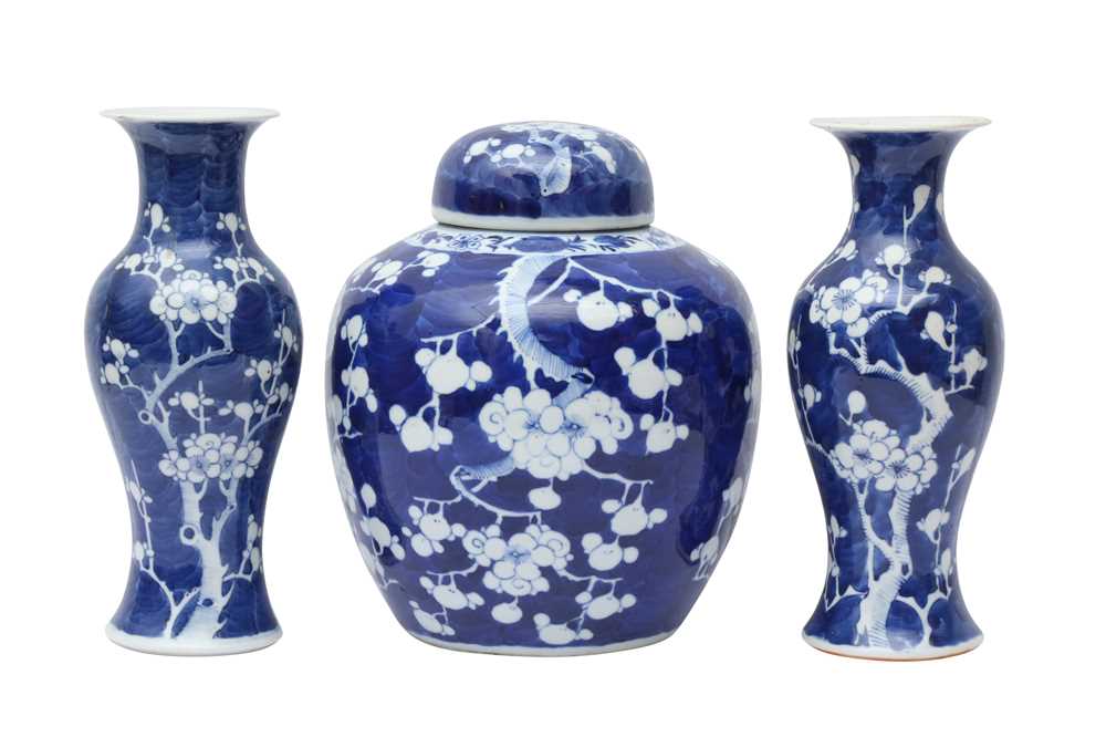 Lot 467 - A CHINESE BLUE AND WHITE 'PRUNUS' JAR AND TWO VASES
