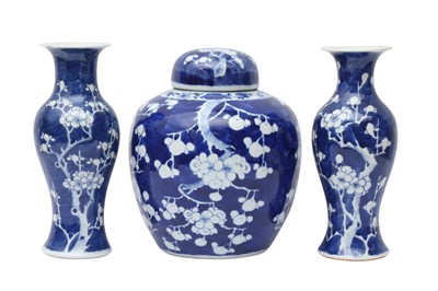Lot 467 - A CHINESE BLUE AND WHITE 'PRUNUS' JAR AND TWO VASES
