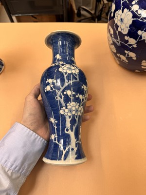 Lot 467 - A CHINESE BLUE AND WHITE 'PRUNUS' JAR AND TWO VASES