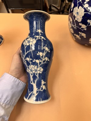 Lot 467 - A CHINESE BLUE AND WHITE 'PRUNUS' JAR AND TWO VASES