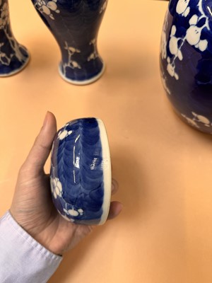 Lot 467 - A CHINESE BLUE AND WHITE 'PRUNUS' JAR AND TWO VASES