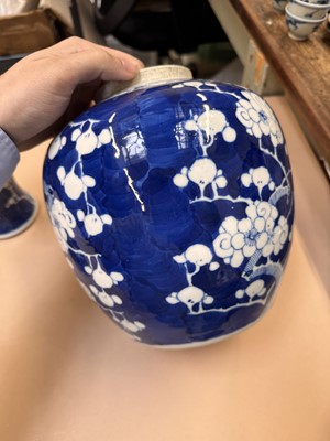 Lot 467 - A CHINESE BLUE AND WHITE 'PRUNUS' JAR AND TWO VASES