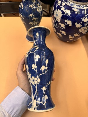 Lot 467 - A CHINESE BLUE AND WHITE 'PRUNUS' JAR AND TWO VASES