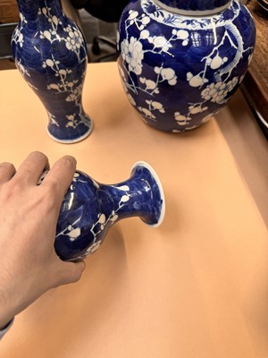 Lot 467 - A CHINESE BLUE AND WHITE 'PRUNUS' JAR AND TWO VASES