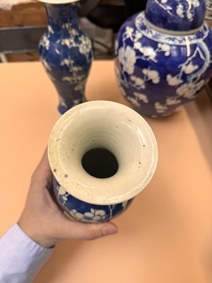 Lot 467 - A CHINESE BLUE AND WHITE 'PRUNUS' JAR AND TWO VASES