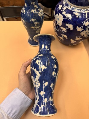 Lot 467 - A CHINESE BLUE AND WHITE 'PRUNUS' JAR AND TWO VASES