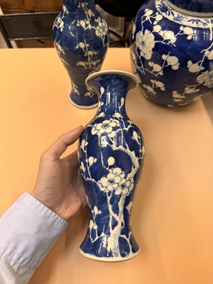 Lot 467 - A CHINESE BLUE AND WHITE 'PRUNUS' JAR AND TWO VASES