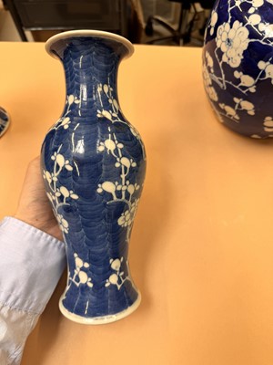Lot 467 - A CHINESE BLUE AND WHITE 'PRUNUS' JAR AND TWO VASES