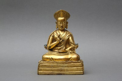 Lot 558 - A SINO-TIBETAN GILT BRONZE FIGURE OF THE THIRD CHANGKYA HUTUKTU, ROLPAI DORJE