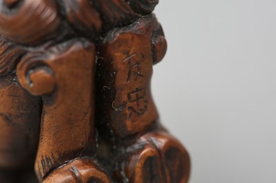 Lot 417 - A JAPANESE BOXWOOD NETSUKE OF A MYTHICAL KIRIN, AFTER TOMOTADA