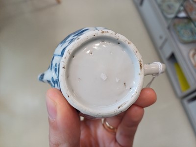 Lot 424 - A SMALL CHINESE BLUE AND WHITE TEAPOT AND COVER