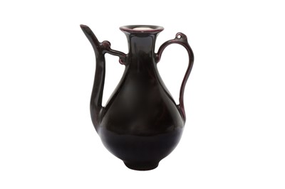 Lot 650 - A CHINESE MONOCHROME AUBERGINE-GLAZED EWER