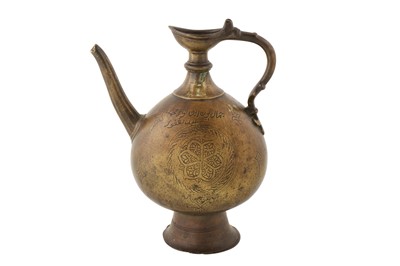 Lot 68 - A 16TH CENTURY MUGHAL BRASS EWER WITH HANDLE