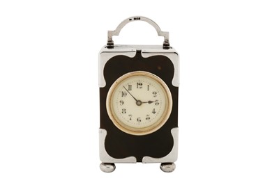 Lot 68 - An Edwardian sterling silver mounted tortoiseshell timepiece or clock, London 1902 by HA