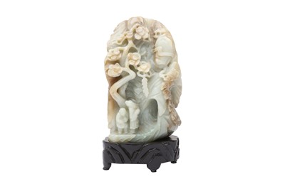 Lot 556 - A CHINESE CELADON AND CREAM JADE BOULDER CARVING