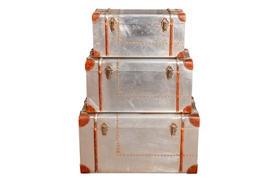 Lot 371 - A GRADUATED SET OF THREE AVIATION-INSPIRED TRUNKS