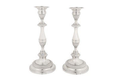 Lot 226 - A pair of early 19th century Portuguese silver candlesticks, Porto circa 1810 by LARA (unidentified, V.1334)