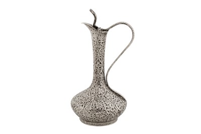 Lot 212 - A late 19th / early 20th century Anglo – Indian unmarked silver small ewer, Kashmir circa 1900