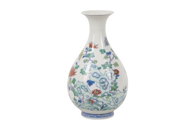 Lot 282 - A CHINESE DOUCAI PEAR-SHAPED 'BLOSSOMS' VASE