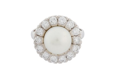 Lot 297 - A PEARL AND DIAMOND CLUSTER RING