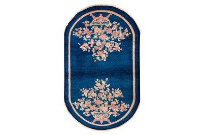Lot 14 - A FINE CHINESE OVAL RUG
