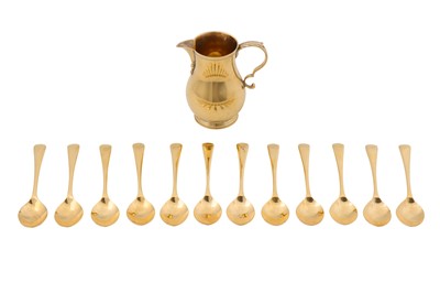 Lot 112 - A George V sterling silver gilt cream jug, London 1922 by Wilson and Sharp overstriking another