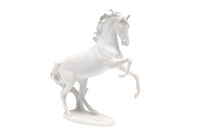Lot 412 - A KAISER BLANC DE CHINE PORCELAIN FIGURE OF A REARING HORSE, SECOND HALF OF THE 20TH CENTURY