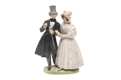 Lot 411 - A ROYAL COPENHAGEN PORCELAIN FIGURAL GROUP, MODELLED AS A PROMENADING VICTORIAN COUPLE