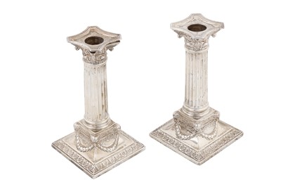 Lot 194 - A pair of Victorian sterling silver candlesticks, Sheffield 1899 by Martin, Hall, and Co
