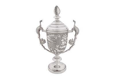 Lot 91 - An early 20th century Chinese export silver twin handled cup and cover, Shanghai circa 1930, retailed by Zee Sung