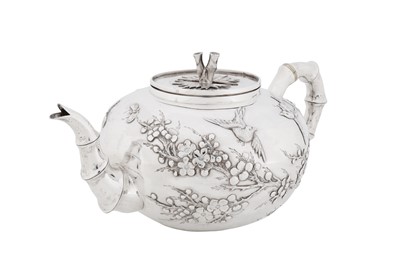 Lot 123 - A late 19th / early 20th century Chinese export silver three-piece tea service, Canton circa 1900, marked Ye Bo, retailed by Wang Hing