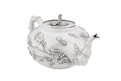 Lot 123 - A late 19th / early 20th century Chinese export silver three-piece tea service, Canton circa 1900, marked Ye Bo, retailed by Wang Hing