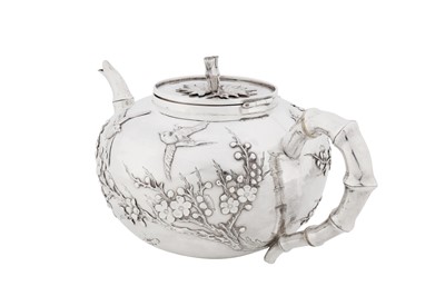 Lot 123 - A late 19th / early 20th century Chinese export silver three-piece tea service, Canton circa 1900, marked Ye Bo, retailed by Wang Hing