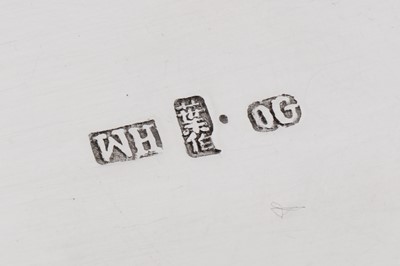 Lot 123 - A late 19th / early 20th century Chinese export silver three-piece tea service, Canton circa 1900, marked Ye Bo, retailed by Wang Hing