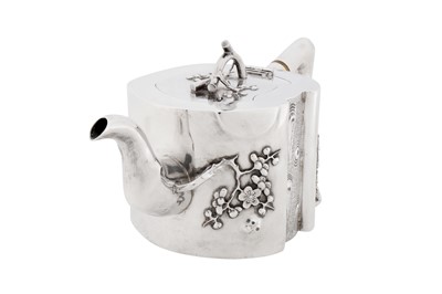 Lot 102 - A late 19th / early 20th century Chinese export silver three-piece tea service, Canton or Shanghai circa 1900, marked Qi Xiang, retailed by Pao Kuang of Hong Kong