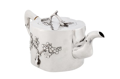 Lot 102 - A late 19th / early 20th century Chinese export silver three-piece tea service, Canton or Shanghai circa 1900, marked Qi Xiang, retailed by Pao Kuang of Hong Kong