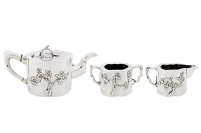 Lot 102 - A late 19th / early 20th century Chinese export silver three-piece tea service, Canton or Shanghai circa 1900, marked Qi Xiang, retailed by Pao Kuang of Hong Kong