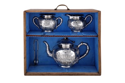 Lot 32 - A cased late 19th / early 20th century Chinese export silver three-piece tea service, Canton circa 1900, marked Ye Bo, retailed by Luen Wo of Shanghai