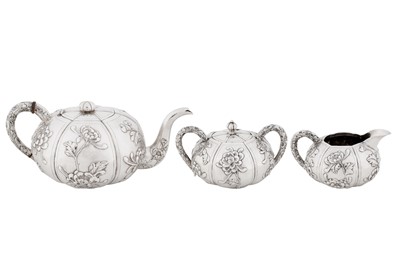 Lot 20 - An early 20th century Chinese export silver three-piece tea service, Shanghai circa 1930, marked Shao Ying Tang, retailed by China Jewellery Company