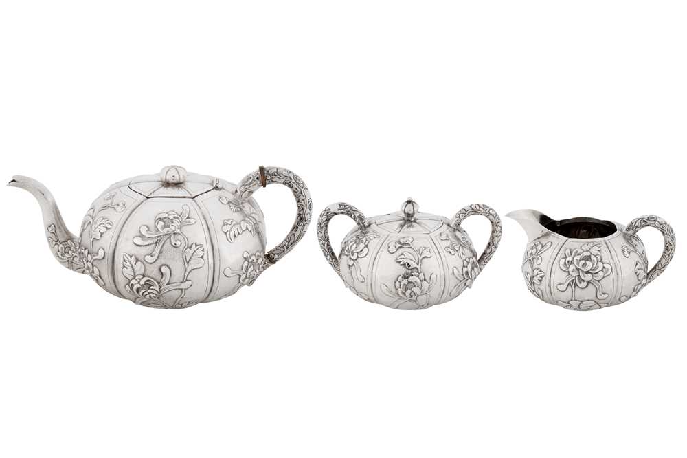Lot 20 - An early 20th century Chinese export silver three-piece tea service, Shanghai circa 1930, marked Shao Ying Tang, retailed by China Jewellery Company