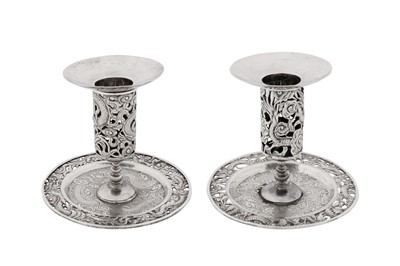 Lot 83 - A pair of early 20th century Chinese export silver candlesticks, Shanghai circa 1920, retailed by Wang Hing