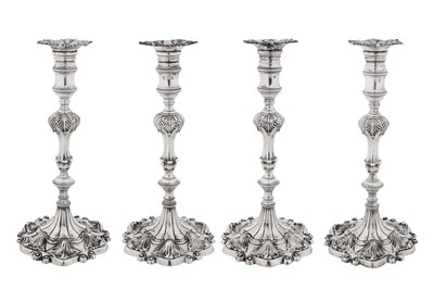 Lot 570 - A set of four George III sterling silver candlesticks, London 1765 by Ebenezer Coker