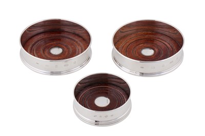 Lot 170 - A pair of Elizabeth II sterling silver wine coasters, London 2002 by Mappin and Webb
