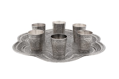 Lot 304 - An early 20th century Persian (Iranian) silver shots set on tray, Isfahan circa 1920 by Ja'far