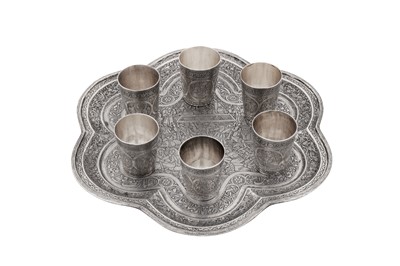 Lot 304 - An early 20th century Persian (Iranian) silver shots set on tray, Isfahan circa 1920 by Ja'far