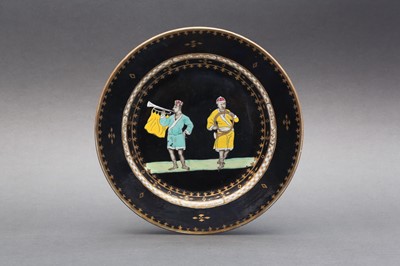 Lot 48 - A RARE CHINESE BLACK-GROUND 'TRUMPETER' DISH