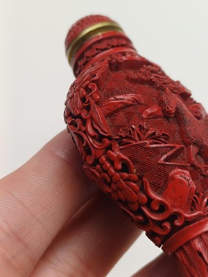 Lot 77 - A CHINESE CINNABAR LACQUER 'HORSES' SNUFF BOTTLE