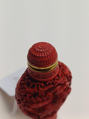 Lot 77 - A CHINESE CINNABAR LACQUER 'HORSES' SNUFF BOTTLE
